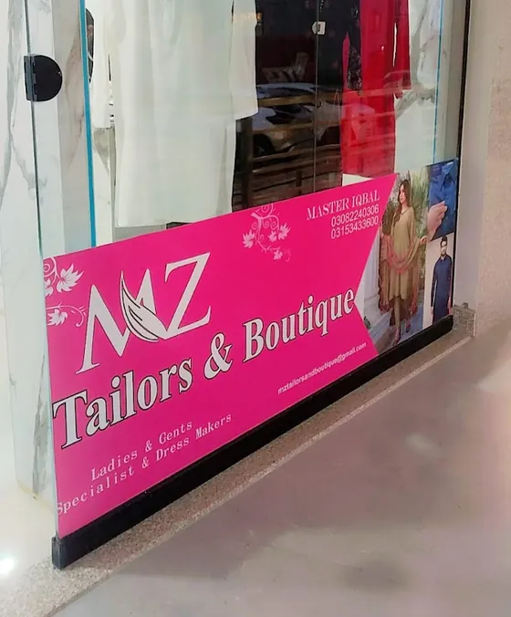 The shop window with the pink MZ Tailors & Boutique board